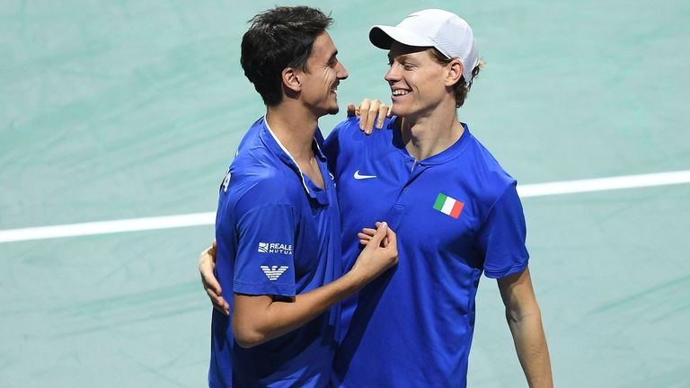Italy&#39;s Jannik Sinner (R) and Lorenzo Sonego celebrate after winning against Serbia&#39;s Novak Djokovic and Momir Kecmanovic during the men&#39;s doubles semifinal tennis match between Italy and Serbia of the Davis Cup tennis tournament at the Martin Carpena sportshall, in Malaga on November 25, 2023. (Photo by JORGE GUERRERO / AFP) (Photo by JORGE GUERRERO/AFP via Getty Images)